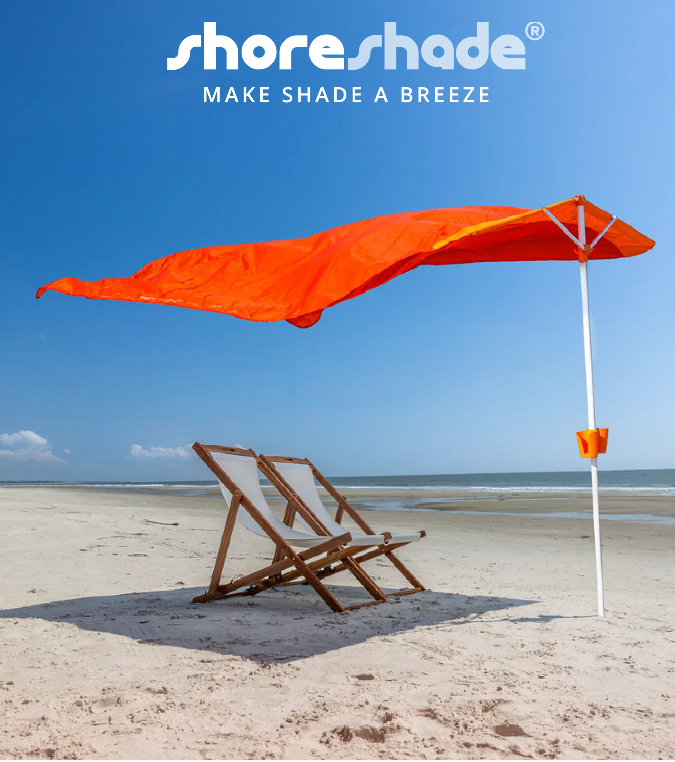 Beach scene with ShoreShade Sail shading area with two chairs.